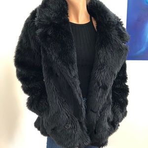 Black fur coat. Small rip on inside liner